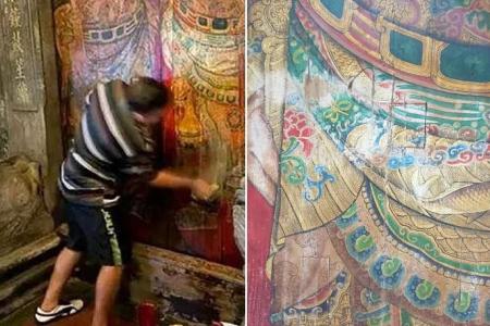Artist’s attempt to ‘clean’ Taiwan temple doors goes awry after he damages deity’s portrait