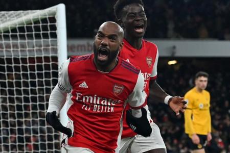 Football: Arsenal snatch vital victory with late goals against Wolves