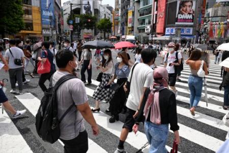 Japan eases border rules to allow business travellers, students