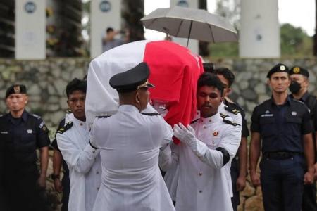 Family and friends bid farewell to NSF firefighter Edward Go at ceremonial funeral in Mandai