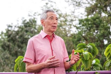 S'poreans must brace themselves for a less peaceful region, period of high inflation: PM Lee