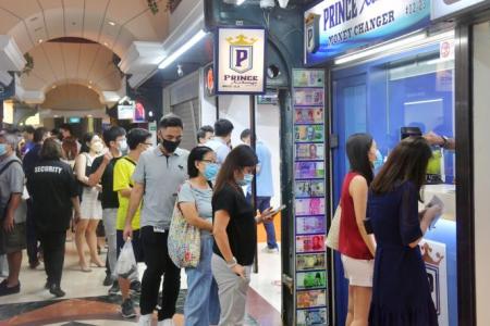 Queues at money changers as Singdollar hits all-time high against Malaysian ringgit
