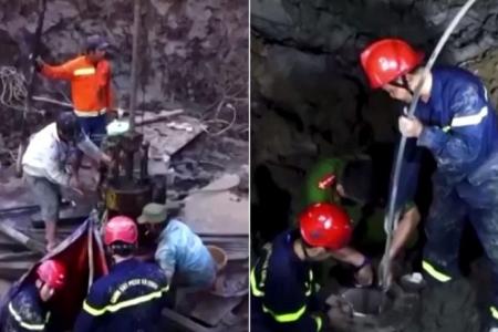 Rescuers in Vietnam try to save boy trapped in concrete pile
