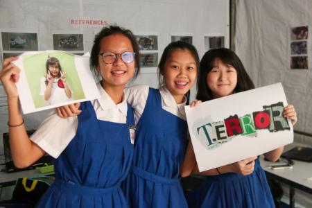 CHIJ St Nicholas Girls' School students Jolene Tan (holding a photo of absent team member Pearlyn Liu), Megan Widjaja Chen and Renee Ng  of Team impossibro made their video TEARor with using stop-animation.