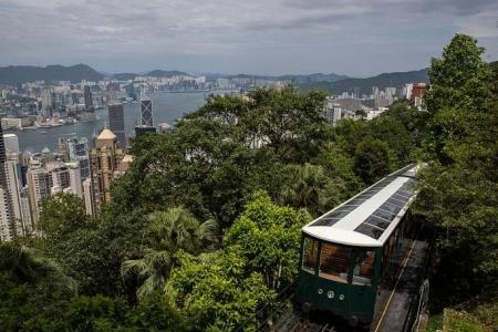 Peak Tram running again but few tourists to enjoy the spectacular ride in Hong Kong
