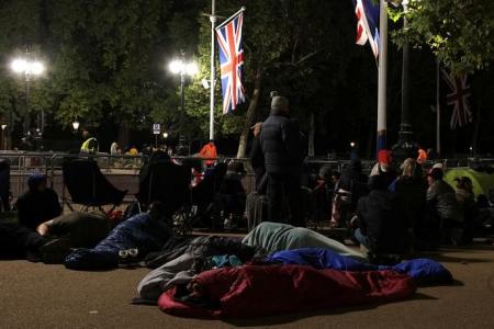 'We couldn't miss this': Thousands camp out for Queen Elizabeth's funeral