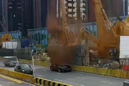 Dislodged hose from construction site sprays mud on car, Marymount Road; no one hurt