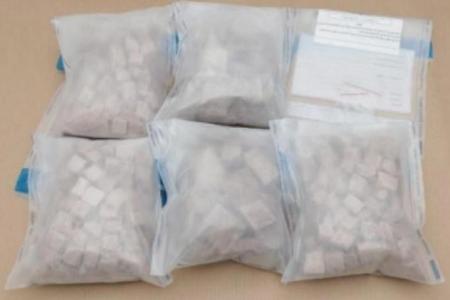 Two Singaporeans arrested over 2.3kg of heroin seized at Woodlands Checkpoint