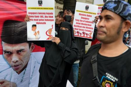Supporters of preacher denied entry to Singapore stage protests in Indonesia