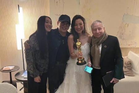 Jet Li congratulates Michelle Yeoh on her Best Actress win at the Oscars