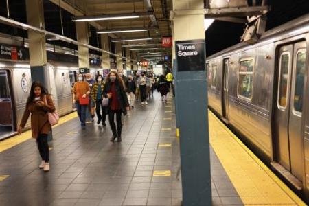 Woman dies after being pushed onto subway tracks in New York's Times Square