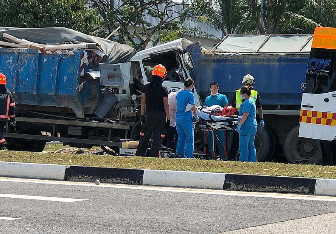 Lorry driver trapped in vehicle for over an hour after Tuas collision
