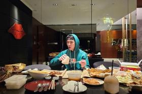 Jam Hsiao's agency shared a photo of him having local food in Singapore.
