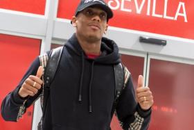 French striker Anthony Martial poses for the media upon his arrival at Seville's airport, on Jan 25, 2022.