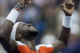 Frances Tiafoe, of the US, reacts after defeating Russia&#039;s Andrey Rublev.