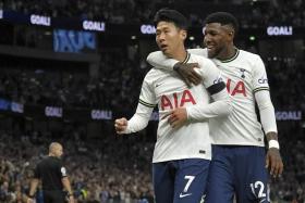 Son Heung-Min (left) celebrates scoring Tottenham&#039;s fifth goal with teammate Emerson Royal.