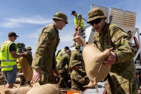 Members of the Australian Defence Force prepare sandbags at the Showgrounds in Shepparton, Victoria, Australia, on Oct 17, 2022.