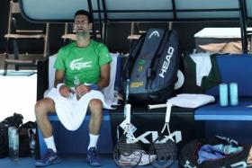 Djokovic rests at Melbourne Park, on Jan 13, 2022, as questions remain over the legal battle regarding his visa to play in the Australian Open. 