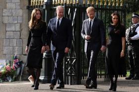 Britain&#039;s Catherine, Princess of Wales, Prince William, Prince Harry and Meghan, Duchess of Sussex,  walk out to greet members of the public at Windsor Castle, near London, following the death of Queen Elizabeth II.
