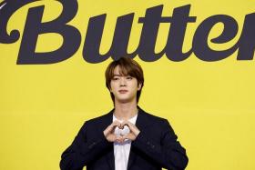 K-pop boy band BTS member Jin promoting their single Butter in Seoul in 2021.