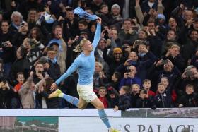 Manchester City&#039;s Erling Haaland celebrates after scoring the winner against Fulham.