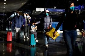 China said from Jan 8 inbound travellers would no longer be required to quarantine upon arrival.