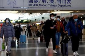 Travellers at the Beijing Capital International Airport, amid the Covid-19 outbreak in Beijing, on Dec 27, 2022.