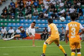 Lion City Sailors’ Kim Shin Wook (in white) scoring a goal against Albirex Niigata during the Singapore Premier League Community Shield match at Jalan Besar Stadium on Feb 19, 2022.