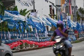 Party flags lining the streets of Tapah in Perak, on Nov 14, 2022.
