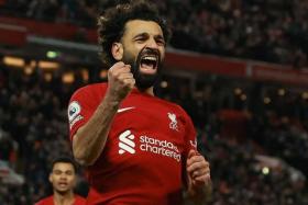 Liverpool&#039;s Mohamed Salah celebrates scoring their second goal.