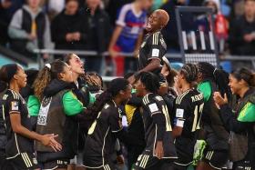 Jamaica's Deneisha Blackwood with her teammates after their first Women's World Cup point, following a draw with fifth-ranked France.