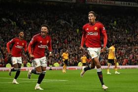  Manchester United&#039;s Raphael Varane celebrating after scoring their first and only goal against Wolves.