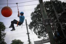 A student from Gan Eng Seng School tackling an obstacle course at the Jalan Bahtera Outdoor Adventure Learning Centre on Wednesday.