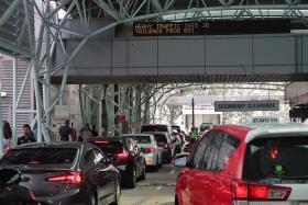Travellers can expect very heavy traffic on March 29 and March 30 at both land checkpoints, ICA said.