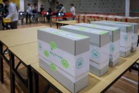 Ballot boxes and Singapore Post boxes containing overseas votes and postal ballot papers at the Elections Department in Novena Rise on Sept 12.