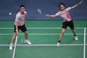 Terry Hee and Jessica Tan in action against Tang Chun Man and Tse Ying Suet of Hong Kong during the 19th Asian Games.
