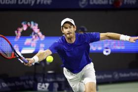 Britain's Andy Murray hitting the ball against Canada's Denis Shapovalov in the first round of the Dubai Tennis Championships.