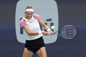 Victoria Azarenka hitting a backhand against Yulia Putintseva on day nine of the Miami Open.