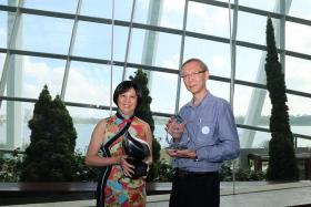 Mee Toh School principal Wang-Tan Sun Sun (left) and SBS Plan and Project Department's Chua Eng Kian receiving the Singapore Watermark Award and the Water Efficiency Award (Projects), respectively.