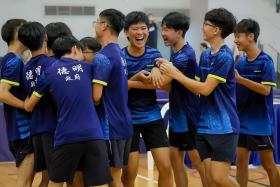 Players from Dunman High School celebrating after winning the B Division boys’ table tennis final against Raffles Institution.