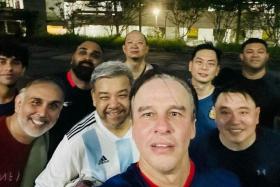 Sports commentator and former radio DJ Mark Richmond (centre) spent the past month meeting friends before leaving for Orlando.