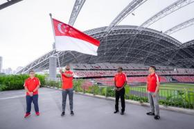 (From left) MCCY Minister Edwin Tong, Team Singapore flagbearer Sheik Farhan, chef de mission S. Sinnathurai and SNOC president Tan Chuan-Jin.