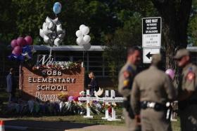 As many as 19 officers waited more than an hour in a hallway outside the classrooms where children were slaughtered.