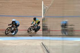 India&#039;s David Beckham Elkatohchoongo (left) competes during the individual sprint qualifying at the Asian Games.