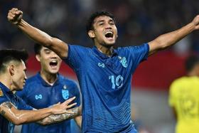 Thailand&#039;s Teerasil Dangda celebrating after scoring the first goal against Malaysia in the second leg of the AFF Championship semi-finals.