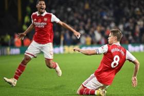 Arsenal&#039;s Martin Odegaard celebrates scoring his team&#039;s second goal during the 2-0 Premier League win at Wolverhampton Wanderers on Nov 12, 2022.
