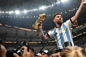 Argentina captain Lionel Messi lifting the World Cup trophy after a thrilling final against France.