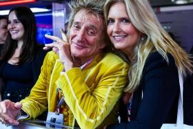 Veteran British singer Rod Stewart and his wife Penny Lancaster at the Red Bull Racing garage, in November 2023.  