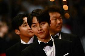 South Korean actor Song Joong-Ki arrives for the screening of Hopeless at the Cannes Film Festival on May 24. 