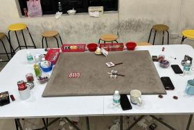 Gambling paraphernalia found in a Geylang unit during the anti-crime blitz by the authorities. 